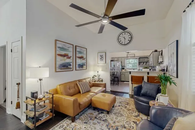 A leather sofa anchors the living room at Ola's Oasis, a Savannah, GA vacation rental home.