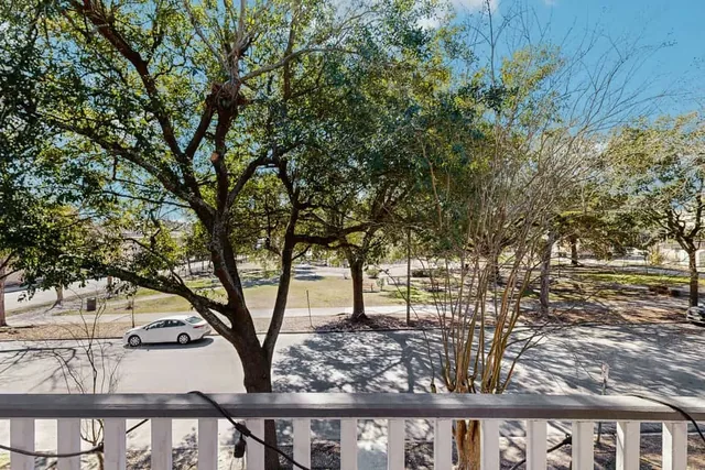 The view from Ola's Oasis overlooks a shaded Savannah, GA square, giving guests a front-row seat to the city's charm.