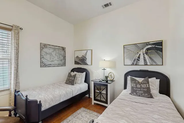 Two matching twin beds make this room at Ola's Oasis, a Savannah, GA vacation rental, ideal for friends or family traveling together.